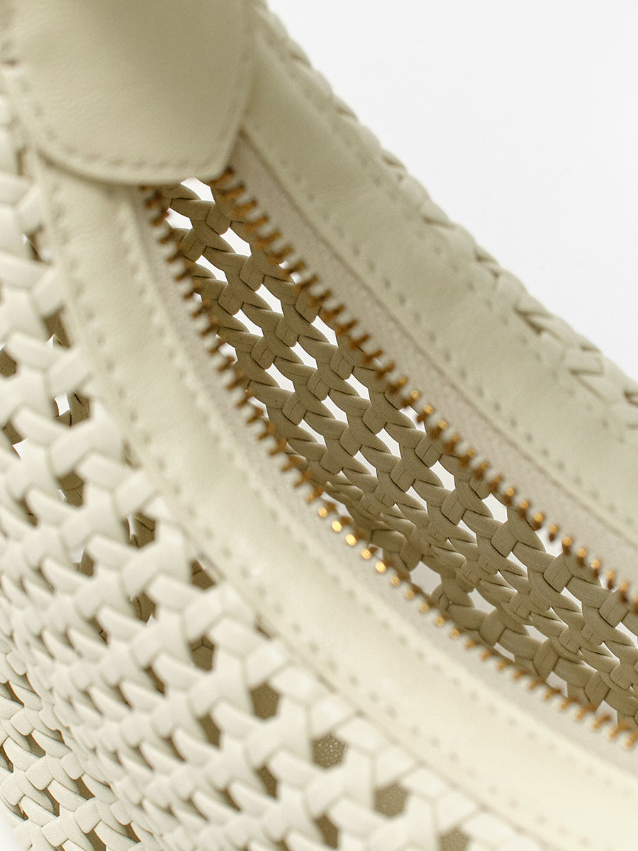 Moon-shaped woven handbag