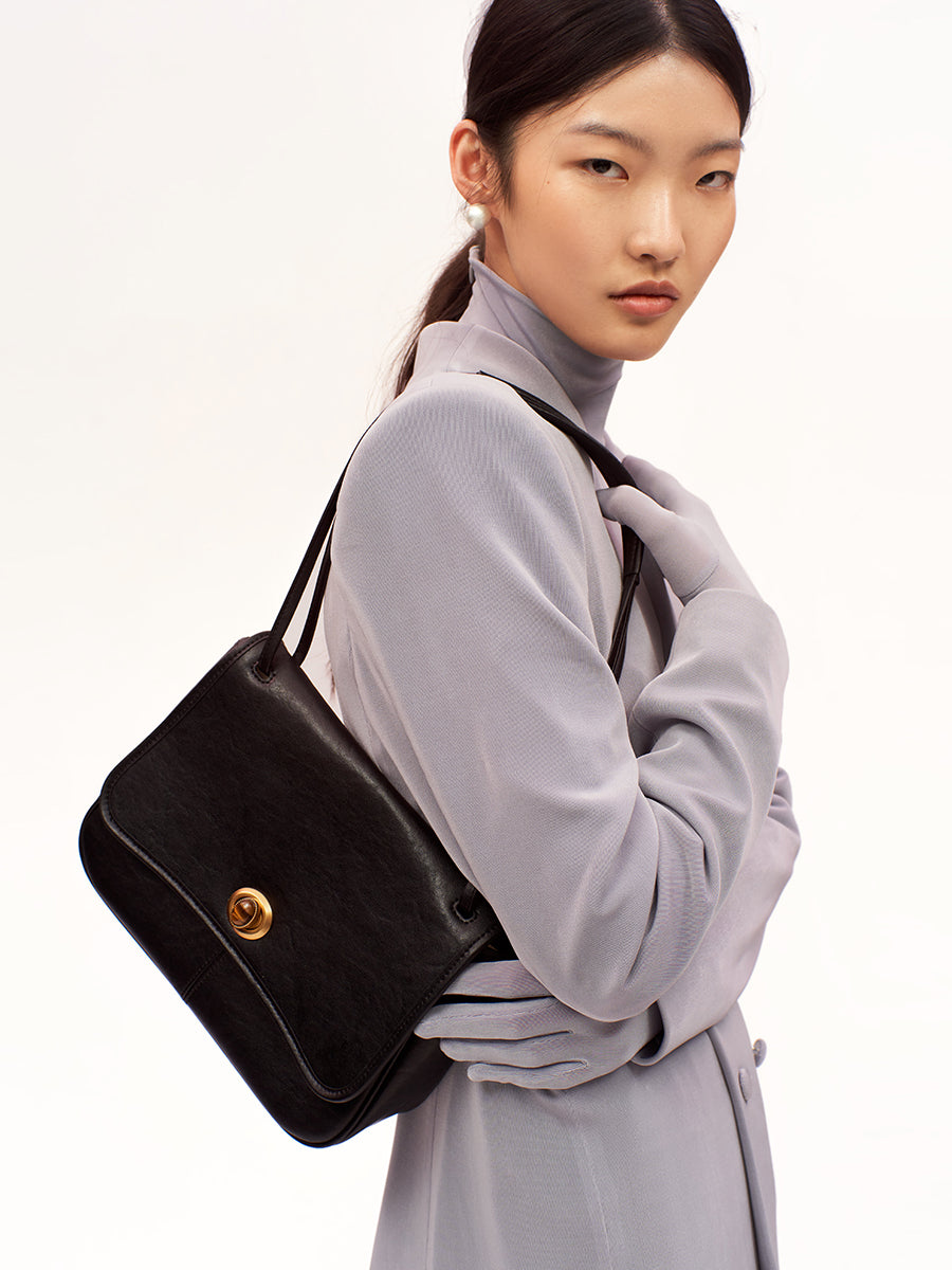 Curved textured square crossbody bag