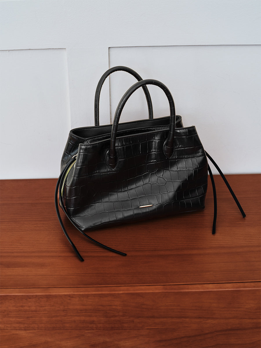 top-grain leather sandwiched bag