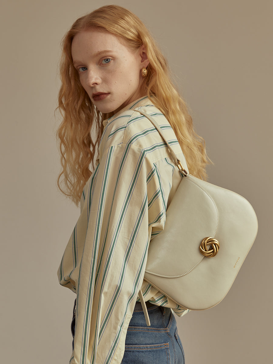 Textured cowhide underarm bag saddle bag