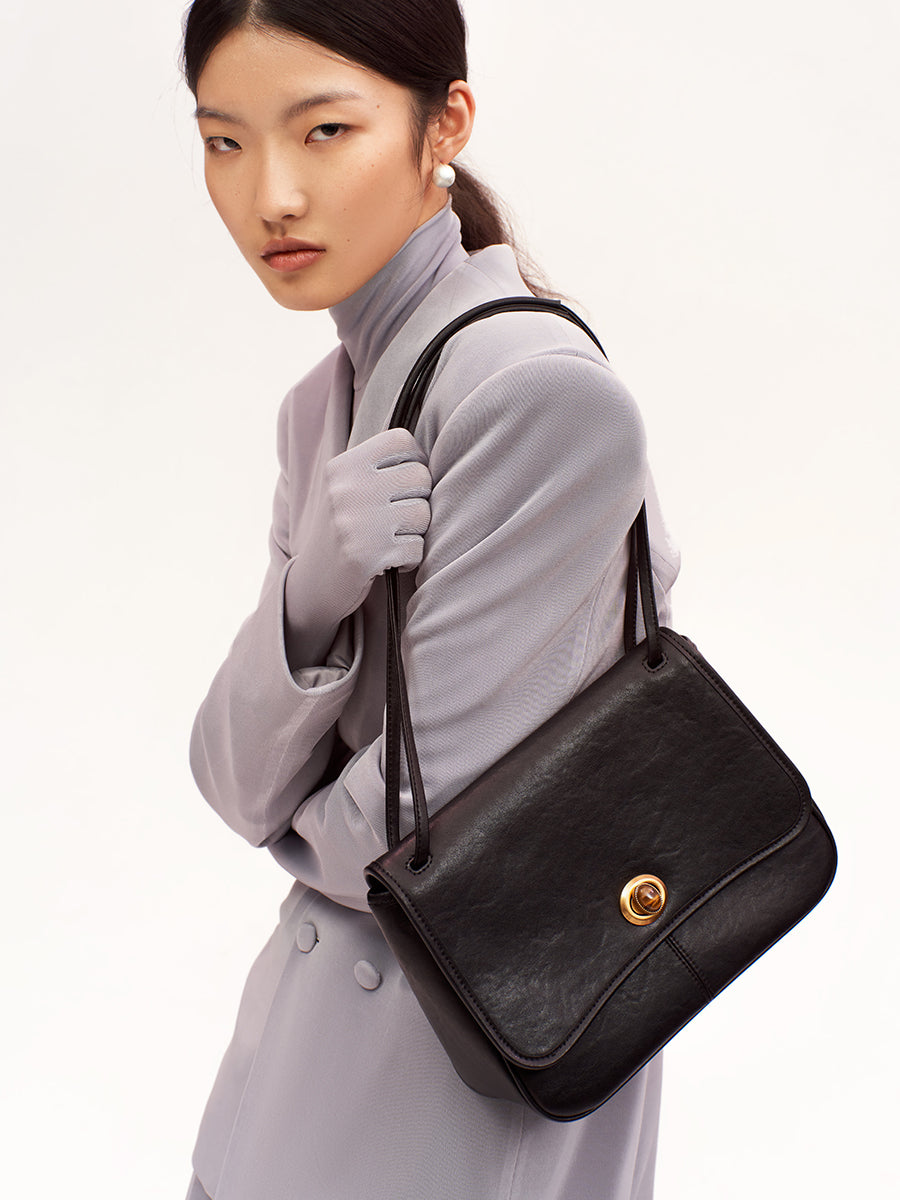 Curved textured square crossbody bag