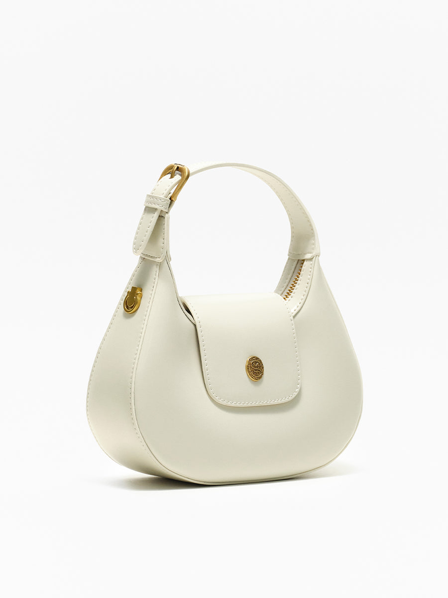 Crescent-shaped handbag with saddle design