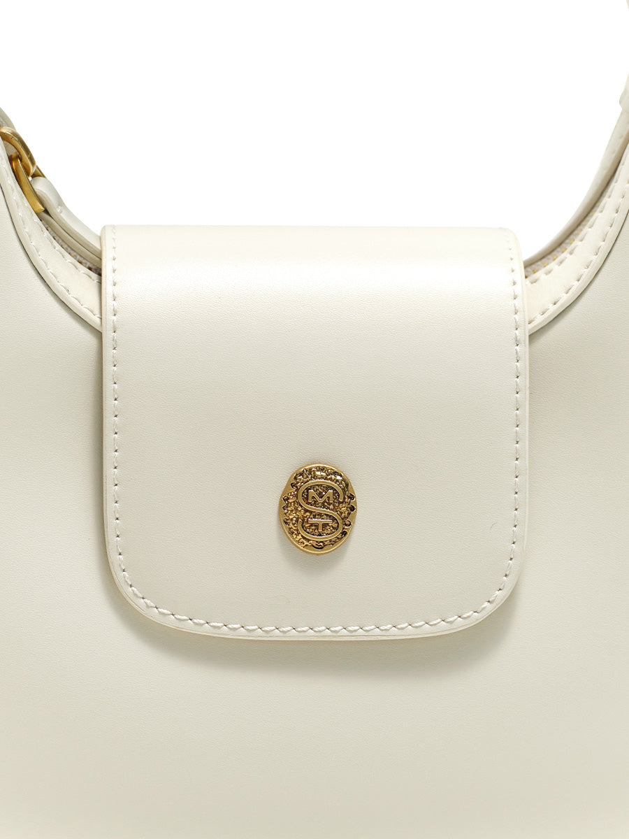 Crescent-shaped handbag with saddle design