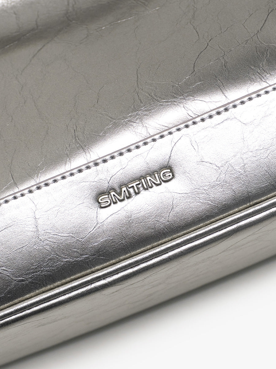 Crescent-shaped underarm bag