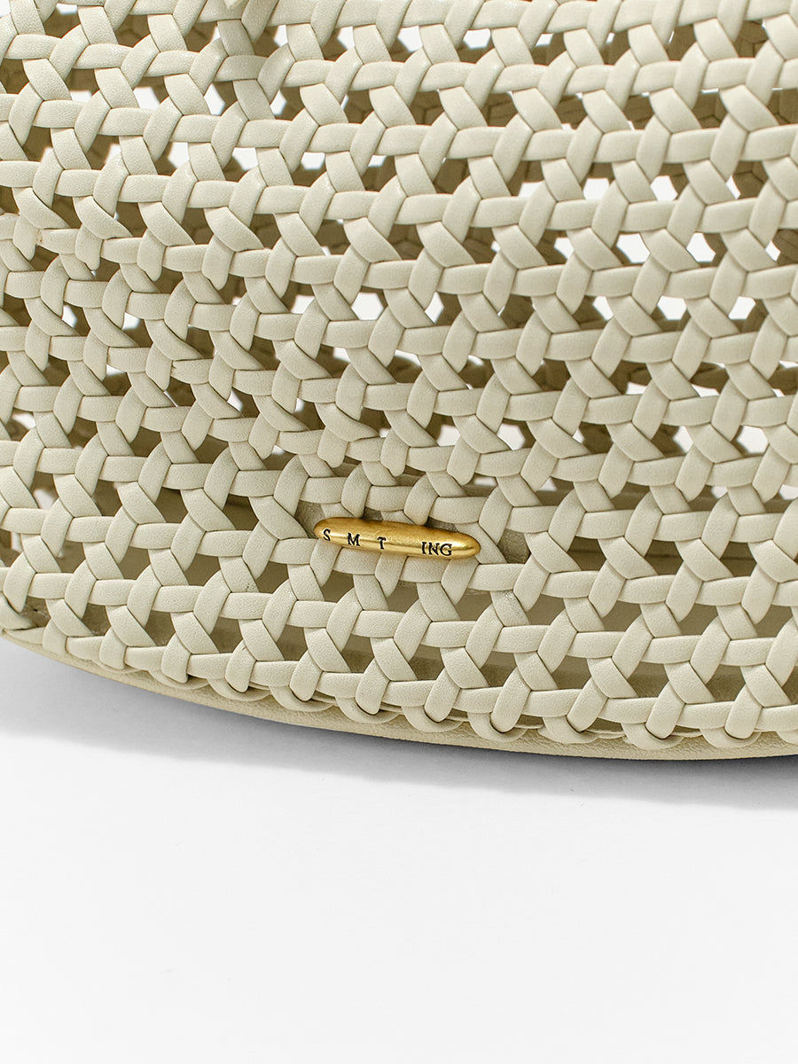 Moon-shaped woven handbag