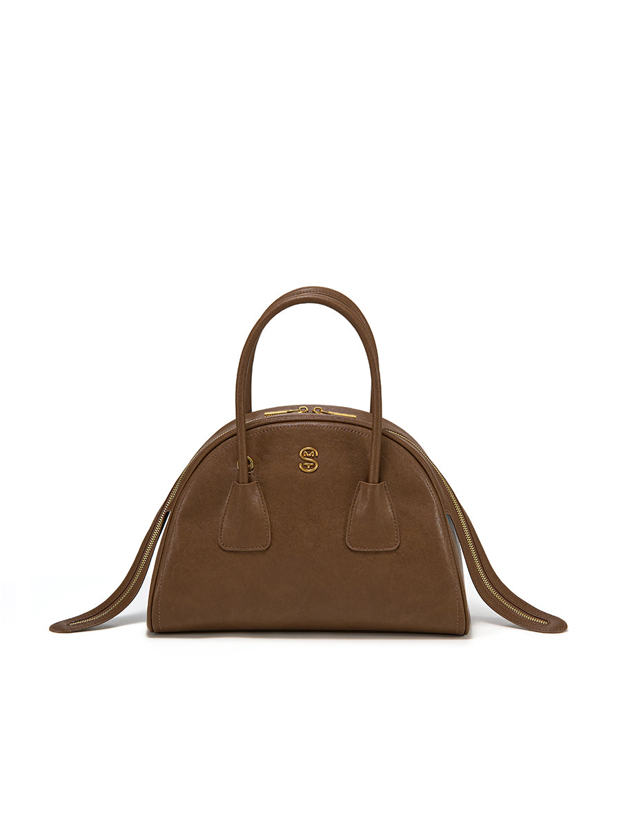 Half-moon shaped boston handbag