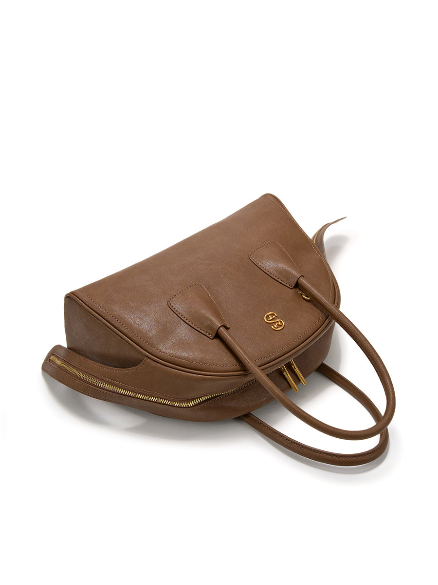 Half-moon shaped boston handbag