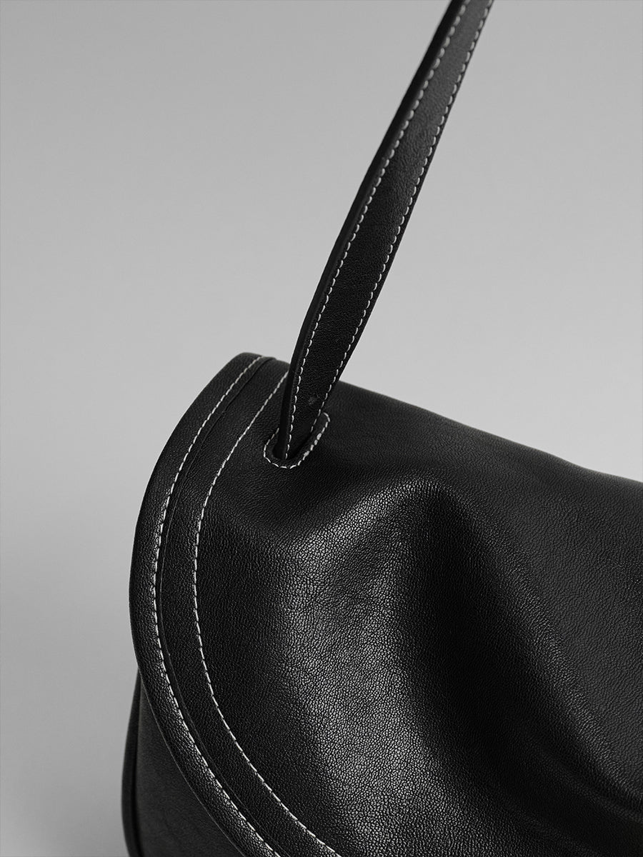Design-conscious luxury underarm bag