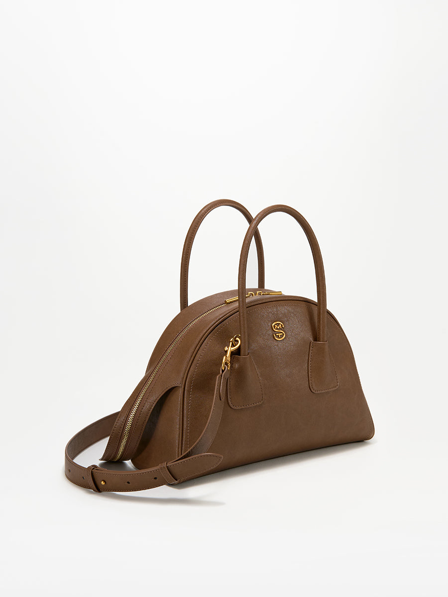 Half-moon shaped boston handbag