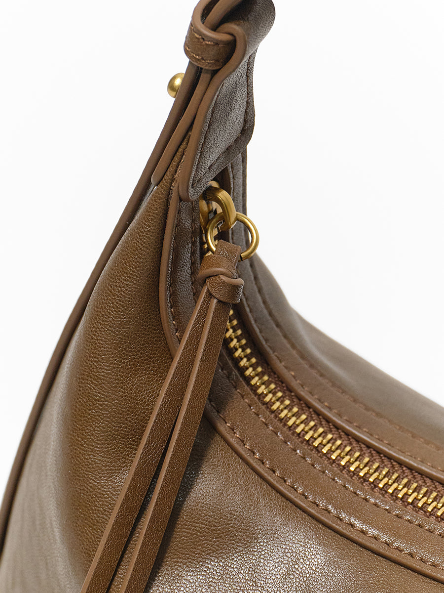 Arc-shaped hand-held hobo bag