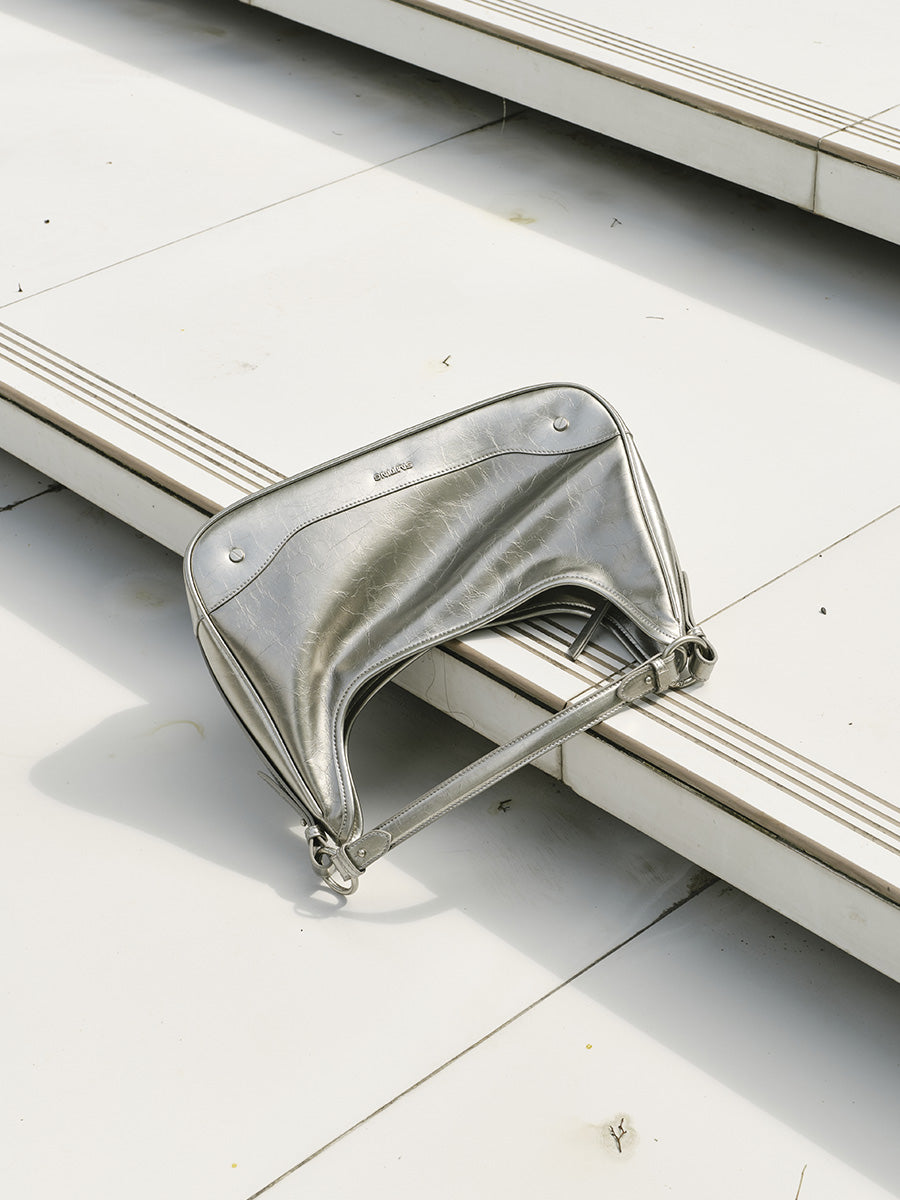 Crescent-shaped underarm bag