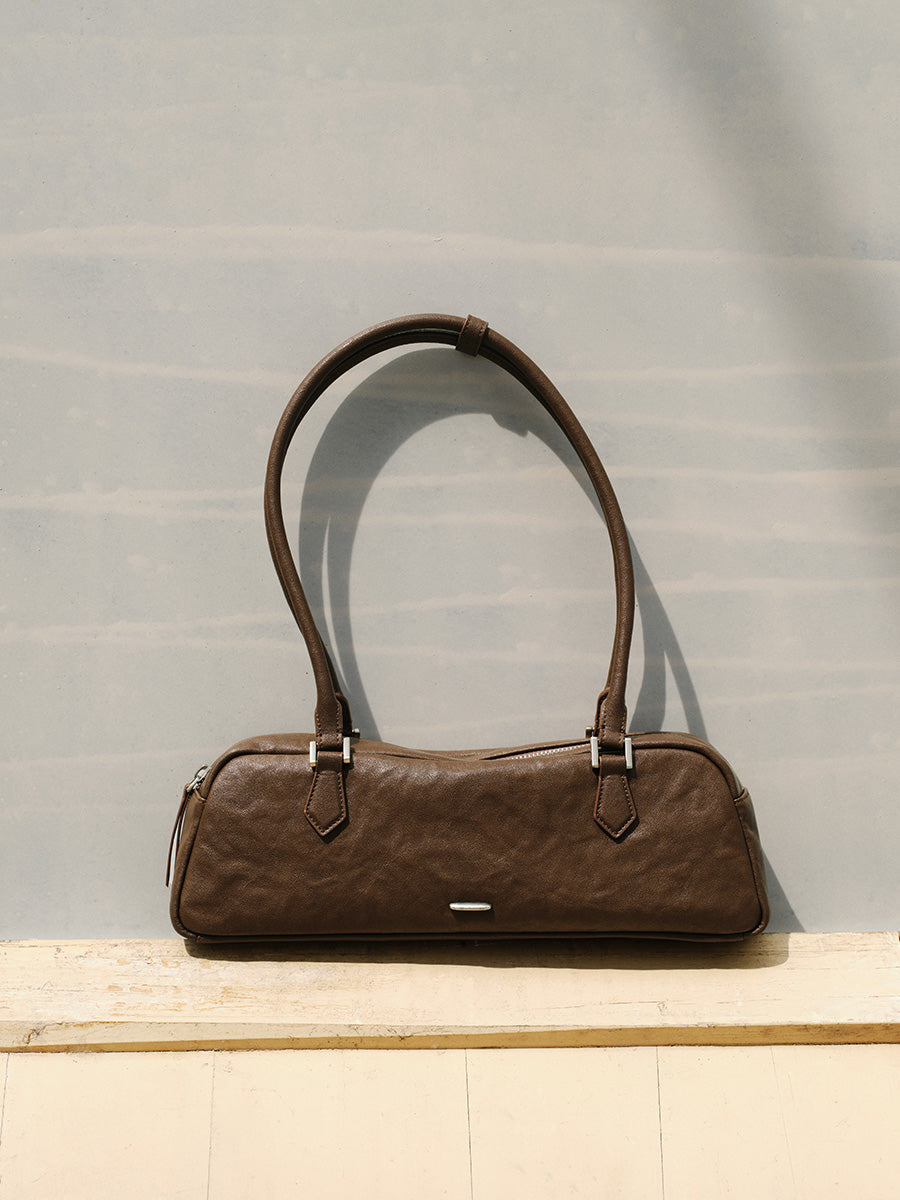 Fashionable and unique pleated baguette bag