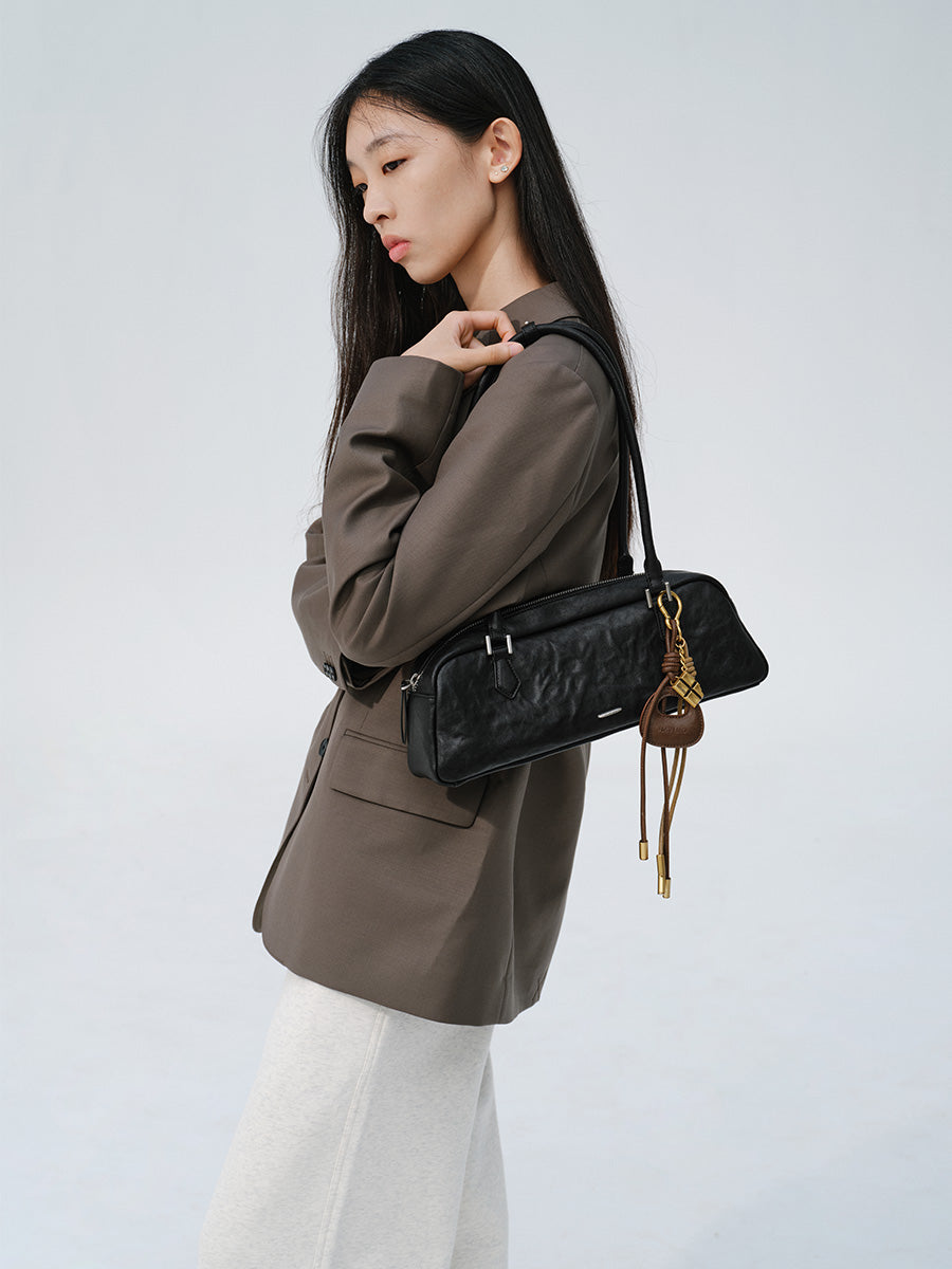 Fashionable and unique pleated baguette bag