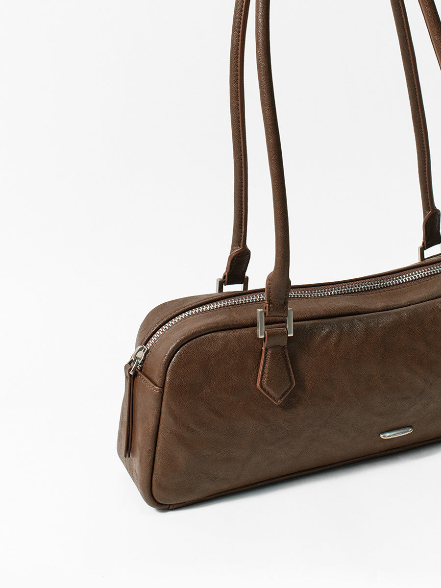 Fashionable and unique pleated baguette bag